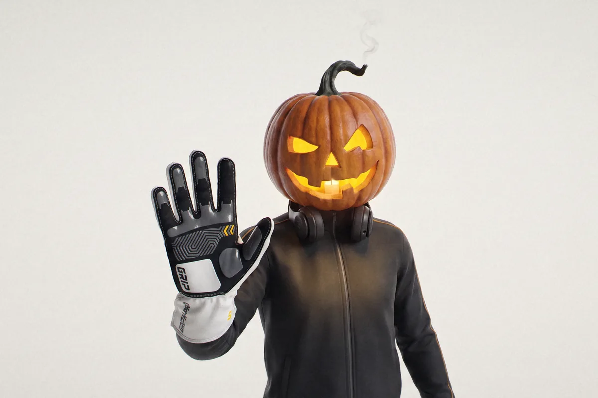Jack, the jack-o'-lantern sim racer, holding up a gloved palm