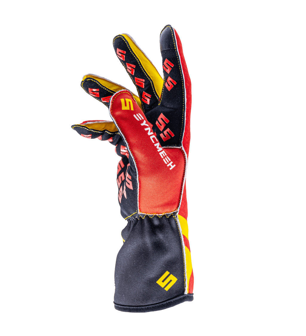Syncmesh Grip M2X Blaze sim racing glove in red and black, angled view showing finger grip pads